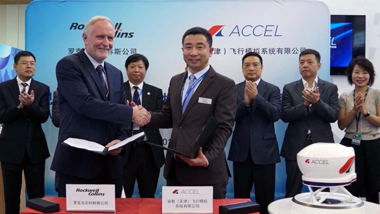 Jim Walker shakes hands with David Kong
