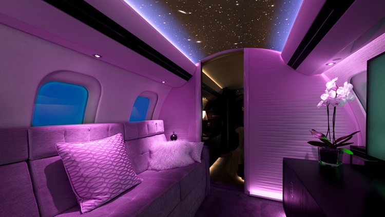 Purple lighting inside business jet cabin